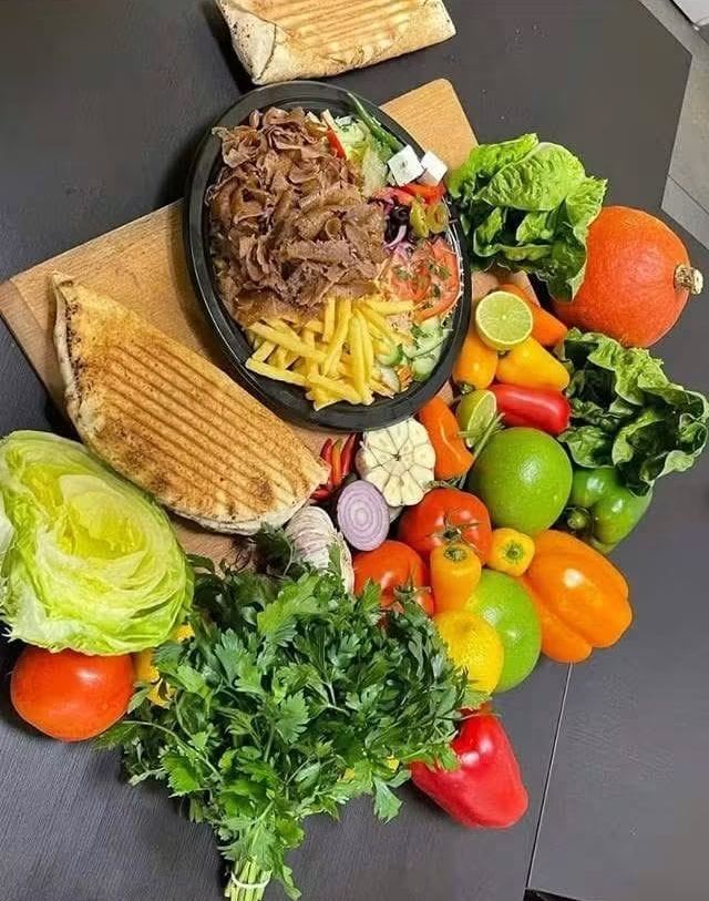 Fresh vegetables, kebab plate and grilled flatbread